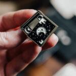 Cosmic video tape enamel pin