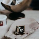Cosmic video tape enamel pin